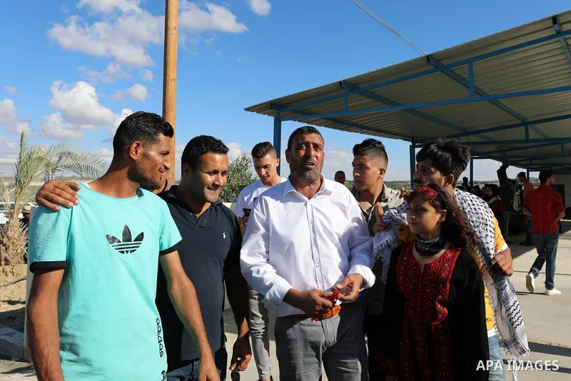 The family of Palestinian female prisoner Nesreen Abu Kamil wait her to enter Gaza Erez crossing in Beit Hanoun in the northern Gaza Strip after she released from Israeli jails on October 19, 2021. The Palestinian prison...