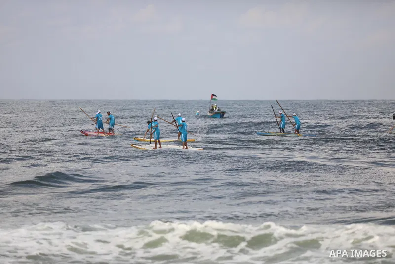 Palestinian players take part in the first sailing and rowing championship on the shore of the Mediterranean, in Gaza city, on Ocotber 20, 2021. The Palestinian Sailing and Rowing Federation organized the first sailing a...