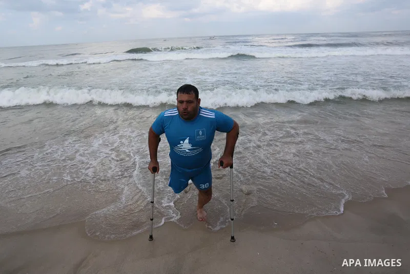 Palestinian players take part in the first sailing and rowing championship on the shore of the Mediterranean, in Gaza city, on Ocotber 20, 2021. The Palestinian Sailing and Rowing Federation organized the first sailing a...