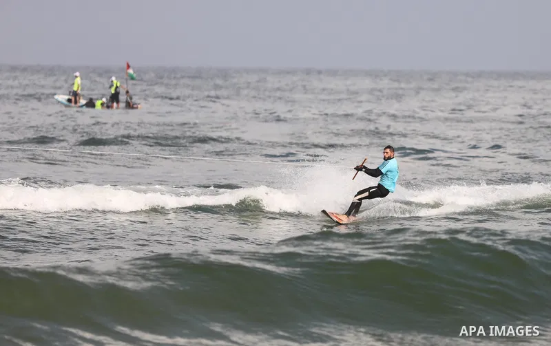 Palestinian players take part in the first sailing and rowing championship on the shore of the Mediterranean, in Gaza city, on Ocotber 20, 2021. The Palestinian Sailing and Rowing Federation organized the first sailing a...