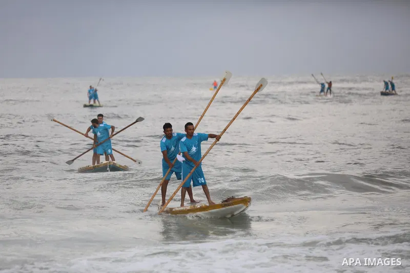 Palestinian players take part in the first sailing and rowing championship on the shore of the Mediterranean, in Gaza city, on Ocotber 20, 2021. The Palestinian Sailing and Rowing Federation organized the first sailing a...