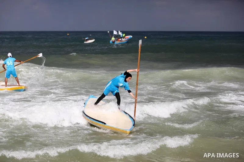 Palestinian players take part in the first sailing and rowing championship on the shore of the Mediterranean, in Gaza city, on Ocotber 20, 2021. The Palestinian Sailing and Rowing Federation organized the first sailing a...