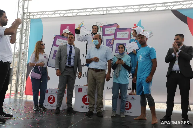 Palestinian players take part in the first sailing and rowing championship on the shore of the Mediterranean, in Gaza city, on Ocotber 20, 2021. The Palestinian Sailing and Rowing Federation organized the first sailing a...