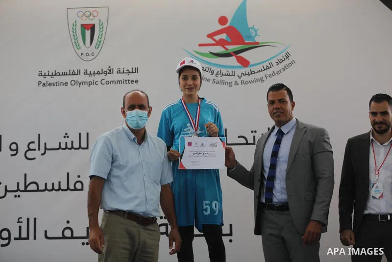 Palestinian players take part in the first sailing and rowing championship on the shore of the Mediterranean, in Gaza city, on Ocotber 20, 2021. The Palestinian Sailing and Rowing Federation organized the first sailing a...