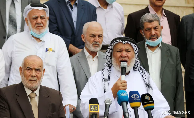 Palestinian Members of Legislative Council, attend a press conference marking the 10th anniversary of prisoners swap deal between Hamas and Israel, in Gaza city on October 20, 2021. October will mark a decade since the l...