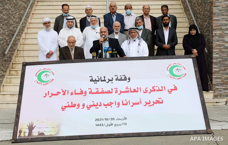 Palestinian Members of Legislative Council, attend a press conference marking the 10th anniversary of prisoners swap deal between Hamas and Israel, in Gaza city on October 20, 2021. October will mark a decade since the l...