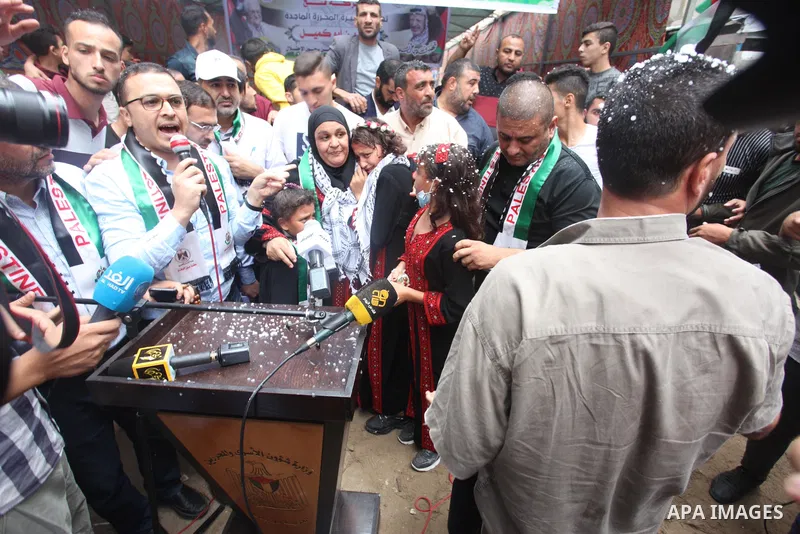 Freed Palestinian female prisoner Nisreen Abu Kamil, 46, is welcomed by her relatives at home in Gaza city, aftre Israel prevent her to enter into Gaza strip, on October 20, 2021. Israeli authorities released a Palestini...
