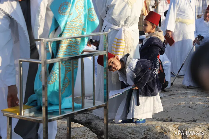 Samaritan worshippers take part in a traditional pilgrimage marking the holiday of Sukkot, or Feast of Tabernacles, on top of Mount Gerizim, near the West Bank city of Nablus, on October 20, 2021. Photo by Wajed Nobani
