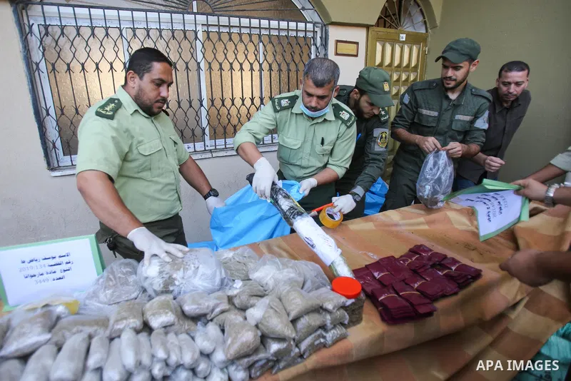 Members of Palestinian anti-drug police display the drugs during a press conference for the destruction of narcotics, in Gaza City on October 21, 2021. Photo by Atia Darwish