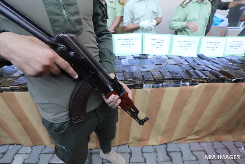 Members of Palestinian anti-drug police display the drugs during a press conference for the destruction of narcotics, in Gaza City on October 21, 2021. Photo by Ashraf Amra