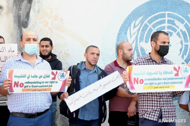 Palestinian teachers take part in a protest demanding their rights in front of the headquarters United Nations Relief and Works Agency (UNRWA), in Gaza City on October 21, 2021. UNRWA froze 250 contracts of the temporary...