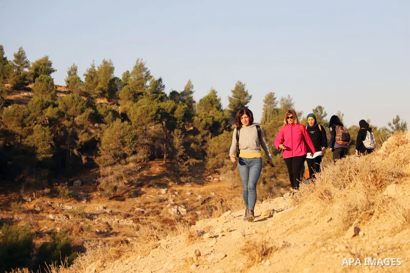 Palestinian adventurers walk amid dangerous cliffs during their journey to explore Valley and Cave of Saint Khreitoun near the West Bank city of Bethlehem, on October 25, 2021. To the southeast of Bethlehem, between the...