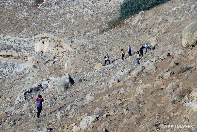 Palestinian adventurers walk amid dangerous cliffs during their journey to explore Valley and Cave of Saint Khreitoun near the West Bank city of Bethlehem, on October 25, 2021. To the southeast of Bethlehem, between the...