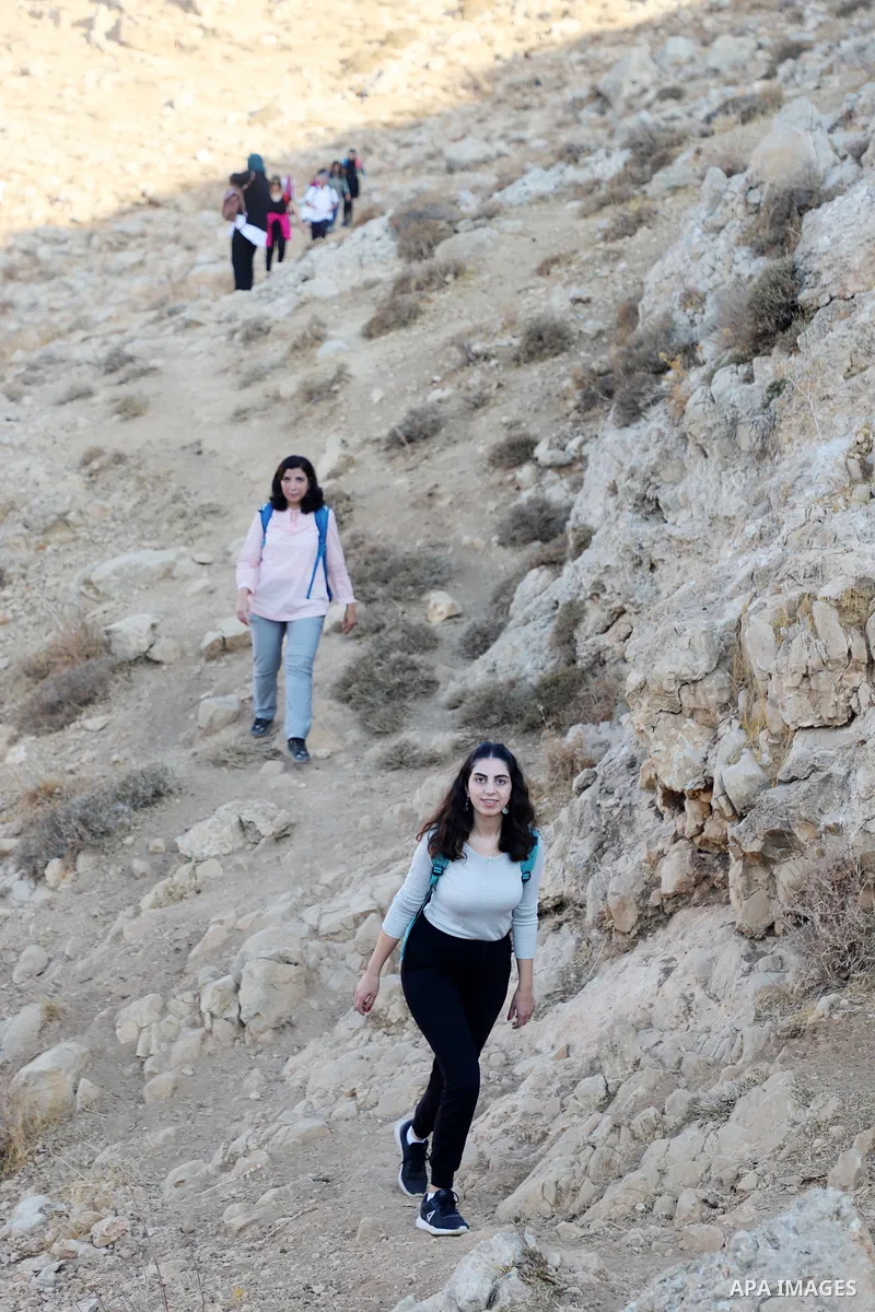 Palestinian adventurers walk amid dangerous cliffs during their journey to explore Valley and Cave of Saint Khreitoun near the West Bank city of Bethlehem, on October 25, 2021. To the southeast of Bethlehem, between the...