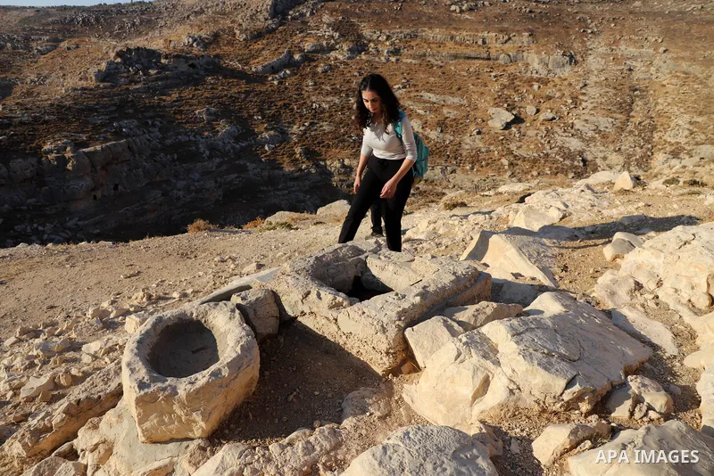 Palestinian adventurers walk amid dangerous cliffs during their journey to explore Valley and Cave of Saint Khreitoun near the West Bank city of Bethlehem, on October 25, 2021. To the southeast of Bethlehem, between the...