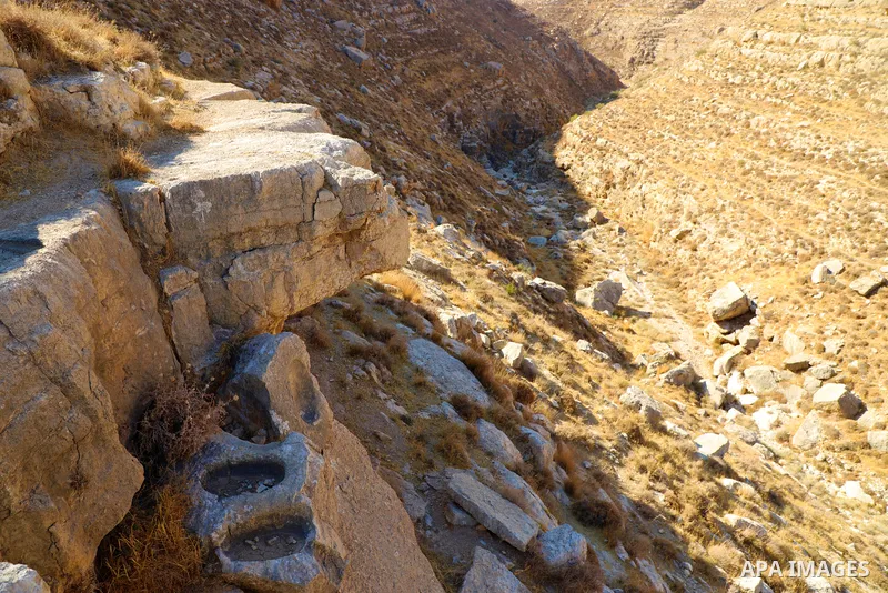 Palestinian adventurers walk amid dangerous cliffs during their journey to explore Valley and Cave of Saint Khreitoun near the West Bank city of Bethlehem, on October 25, 2021. To the southeast of Bethlehem, between the...