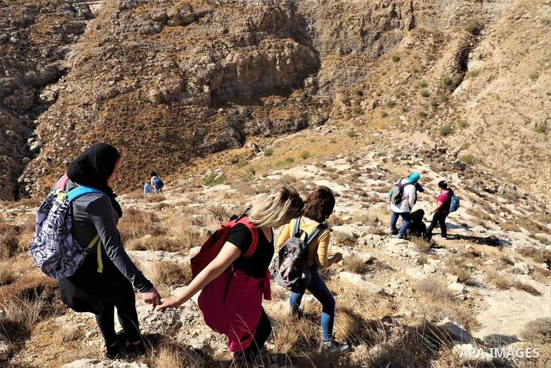 Palestinian adventurers walk amid dangerous cliffs during their journey to explore Valley and Cave of Saint Khreitoun near the West Bank city of Bethlehem, on October 25, 2021. To the southeast of Bethlehem, between the...