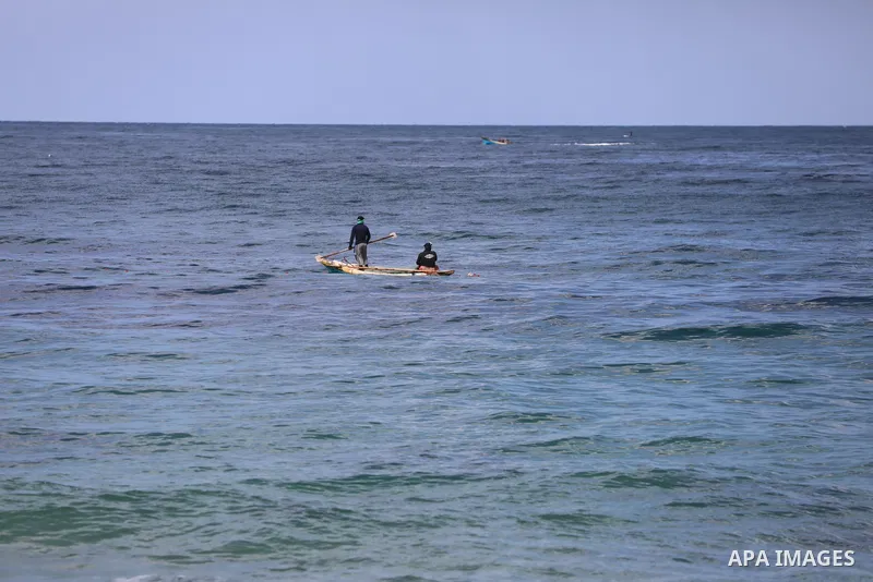 Palestinian fishermen collect fish nets on the beach of the Mediterranean sea in Gaza City, on October 23, 2021. Fishing is a major source of revenue for the impoverished Palestinian enclave. Israel, which maintains a bl...