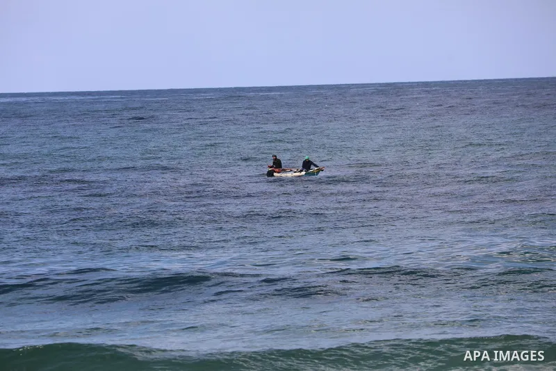 Palestinian fishermen collect fish nets on the beach of the Mediterranean sea in Gaza City, on October 23, 2021. Fishing is a major source of revenue for the impoverished Palestinian enclave. Israel, which maintains a bl...