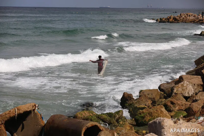 A Palestinian fisherman collects fish nets on the beach of the Mediterranean sea in Gaza City, on October 23, 2021. Fishing is a major source of revenue for the impoverished Palestinian enclave. Israel, which maintains a...