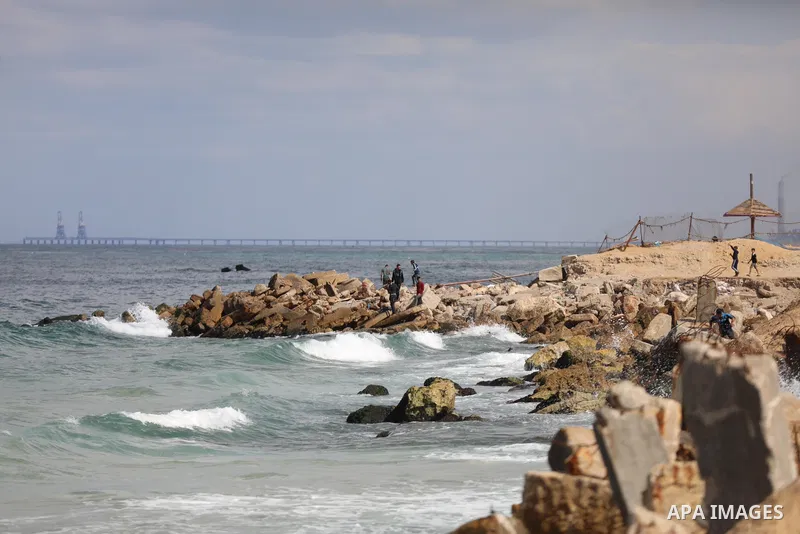 Palestinians enjoy their time at the beach of the Mediterranean sea in Gaza City, on October 23, 2021. Fishing is a major source of revenue for the impoverished Palestinian enclave. Israel, which maintains a blockade on...