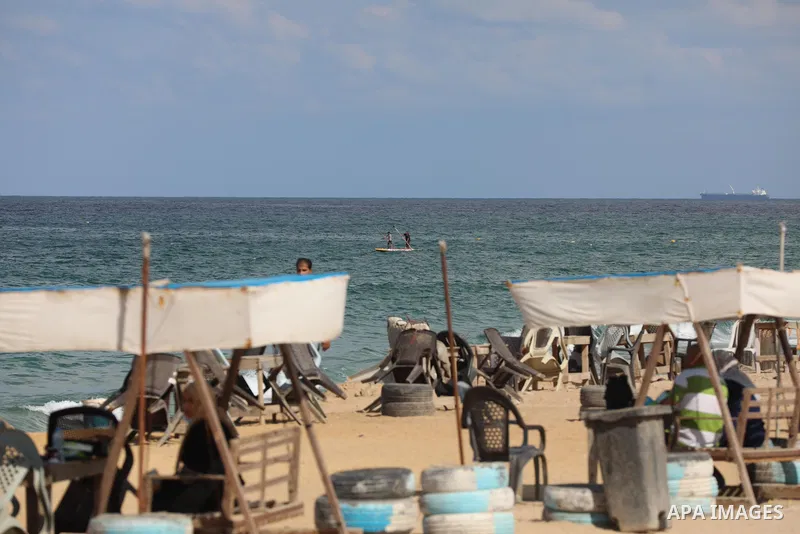 Palestinian fishermen collect fish nets on the beach of the Mediterranean sea in Gaza City, on October 23, 2021. Fishing is a major source of revenue for the impoverished Palestinian enclave. Israel, which maintains a bl...