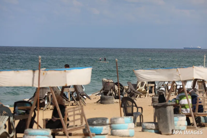 Palestinian fishermen collect fish nets on the beach of the Mediterranean sea in Gaza City, on October 23, 2021. Fishing is a major source of revenue for the impoverished Palestinian enclave. Israel, which maintains a bl...