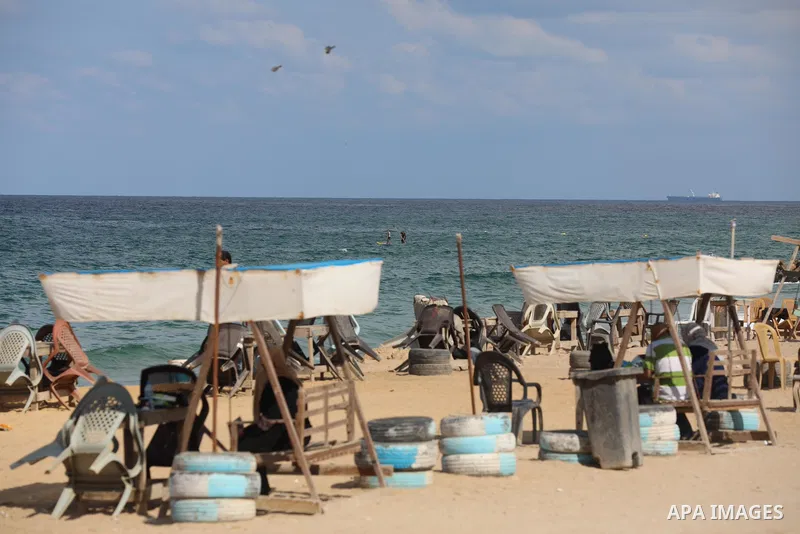 Palestinian fishermen collect fish nets on the beach of the Mediterranean sea in Gaza City, on October 23, 2021. Fishing is a major source of revenue for the impoverished Palestinian enclave. Israel, which maintains a bl...