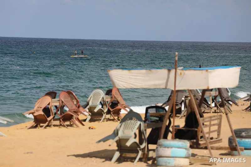 Palestinian fishermen collect fish nets on the beach of the Mediterranean sea in Gaza City, on October 23, 2021. Fishing is a major source of revenue for the impoverished Palestinian enclave. Israel, which maintains a bl...