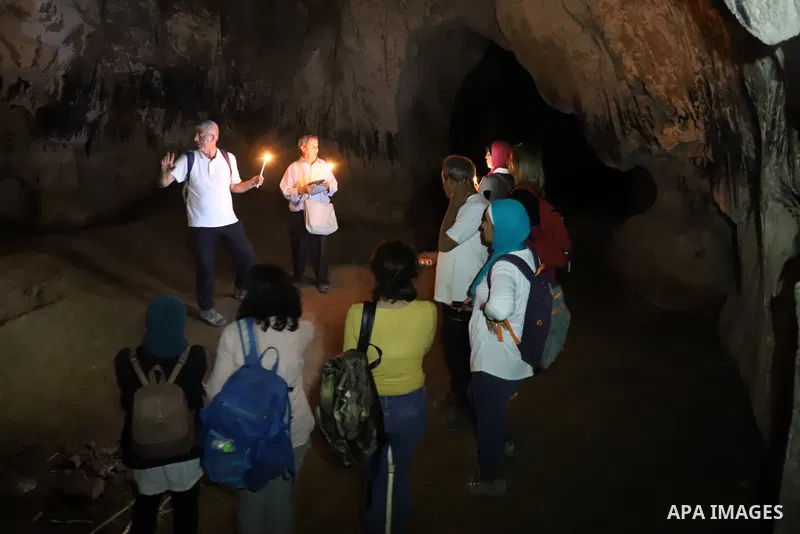 Palestinian adventurers walk amid dangerous cliffs during their journey to explore Valley and Cave of Saint Khreitoun near the West Bank city of Bethlehem, on October 25, 2021. To the southeast of Bethlehem, between the...