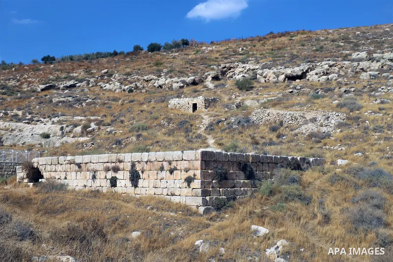 Palestinian adventurers walk amid dangerous cliffs during their journey to explore Valley and Cave of Saint Khreitoun near the West Bank city of Bethlehem, on October 25, 2021. To the southeast of Bethlehem, between the...