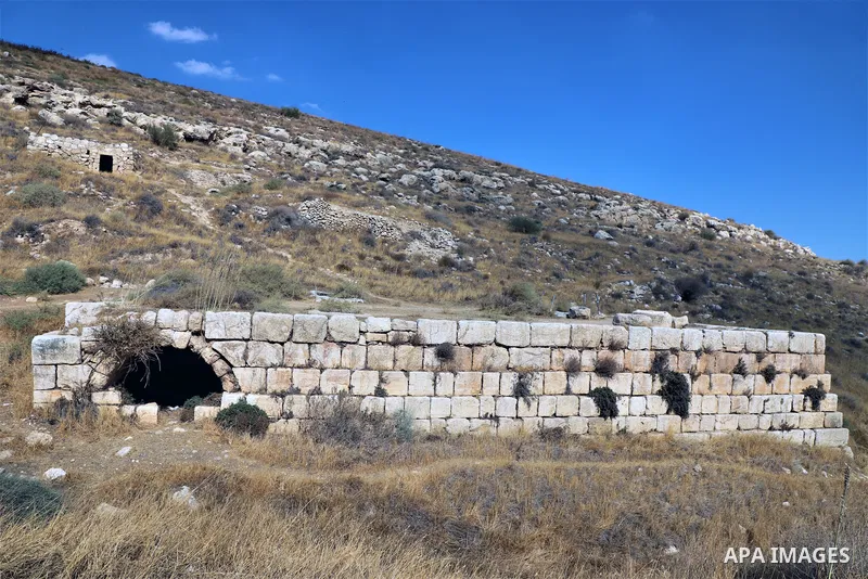 Palestinian adventurers walk amid dangerous cliffs during their journey to explore Valley and Cave of Saint Khreitoun near the West Bank city of Bethlehem, on October 25, 2021. To the southeast of Bethlehem, between the...