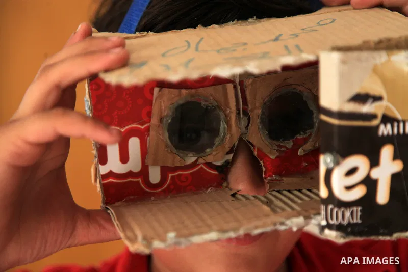 Palestinian inventor Mohammad Al-Hallaq,13, displays his small inventions at his home in Khan Yunis, in the southern Gaza Strip, on October 23, 2021. Al-Hallaq invented the robot for special needs and portable refrigerat...