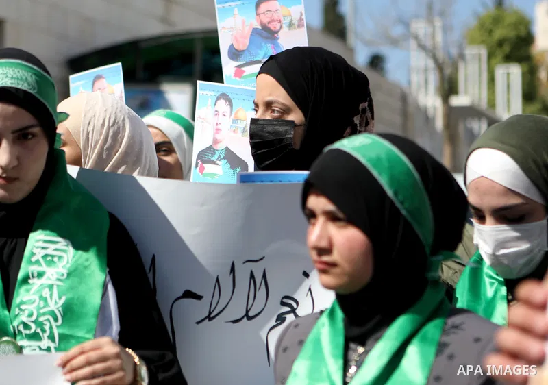 Palestinians take part in a protest in solidarity with prisoners on hunger strike at Israeli jails, in the West Bank city on October 24, 2021. Seven Palestinian prisoners in Israeli detention currently remain on hunger s...