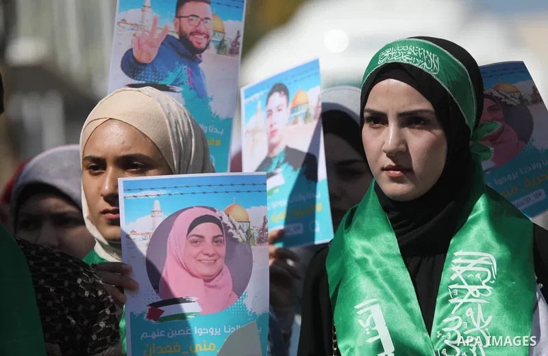 Palestinians take part in a protest in solidarity with prisoners on hunger strike at Israeli jails, in the West Bank city on October 24, 2021. Seven Palestinian prisoners in Israeli detention currently remain on hunger s...
