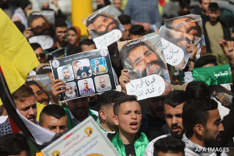 Palestinians take part in a protest in solidarity with prisoners on hunger strike at Israeli jails, in the West Bank city on October 24, 2021. Seven Palestinian prisoners in Israeli detention currently remain on hunger s...