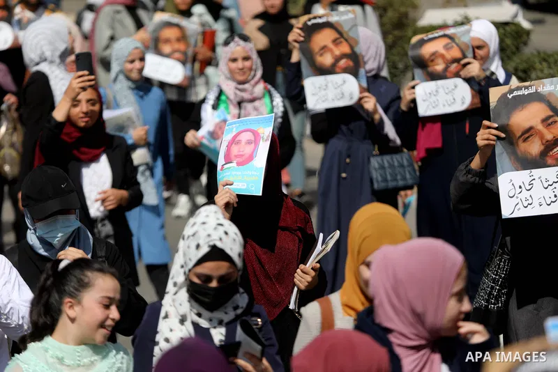 Palestinians take part in a protest in solidarity with prisoners on hunger strike at Israeli jails, in the West Bank city on October 24, 2021. Seven Palestinian prisoners in Israeli detention currently remain on hunger s...