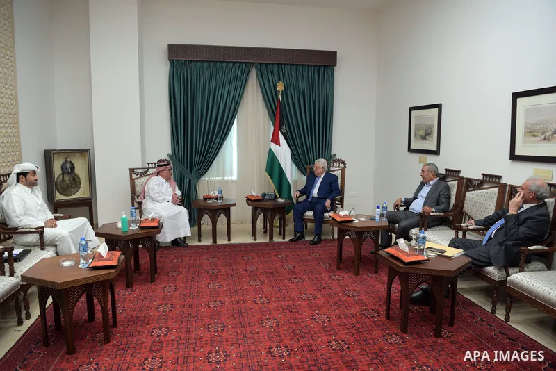 Palestinian president Mahmoud Abbas meets with Qatar's Ambassador to the Palestinian Authority, Mohammed Al Emadi, in the West Bank city of Ramallah on October 24, 2021. Photo by Thaer Ganaim