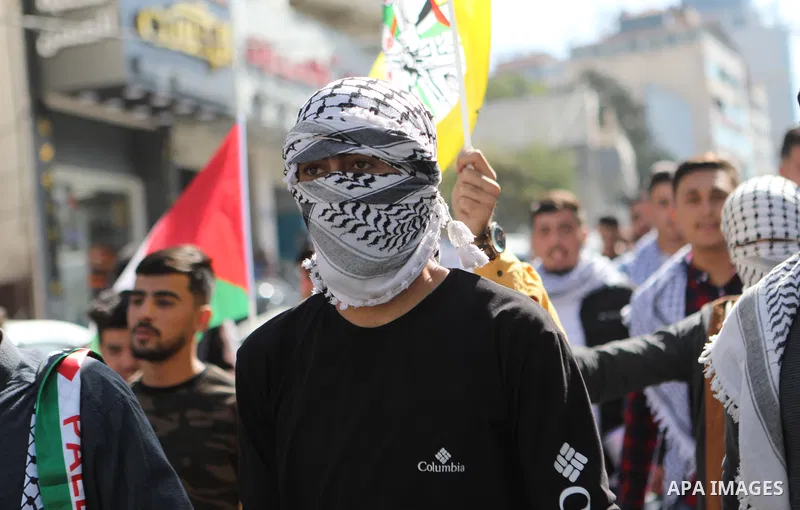 Palestinians take part in a protest in solidarity with prisoners on hunger strike at Israeli jails, in the West Bank city on October 24, 2021. Seven Palestinian prisoners in Israeli detention currently remain on hunger s...