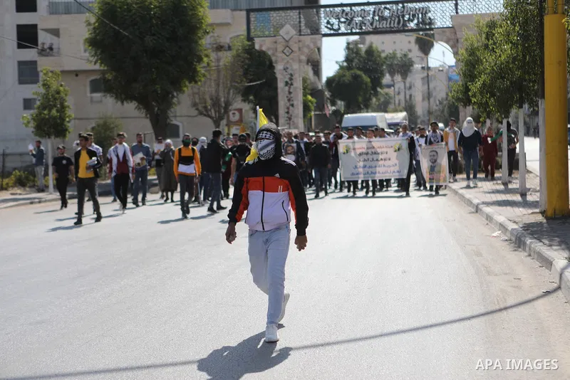 Palestinians take part in a protest in solidarity with prisoners on hunger strike at Israeli jails, in the West Bank city on October 24, 2021. Seven Palestinian prisoners in Israeli detention currently remain on hunger s...