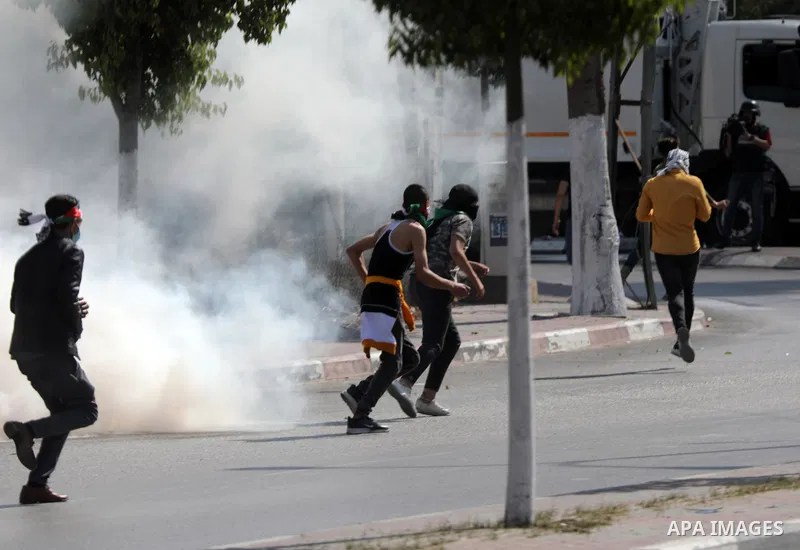 Palestinian protesters clash with Israeli forces following a demonstration calling for the release of Palestinian prisoners on hunger strike in Israeli jails, in the West Bank city of Hebron on October 24, 2021. Seven Pa...