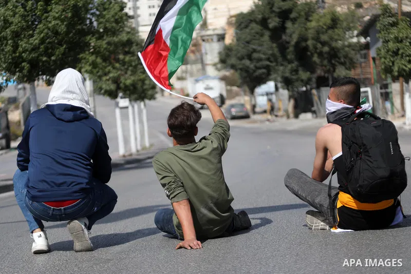 Palestinian protesters clash with Israeli forces following a demonstration calling for the release of Palestinian prisoners on hunger strike in Israeli jails, in the West Bank city of Hebron on October 24, 2021. Seven Pa...