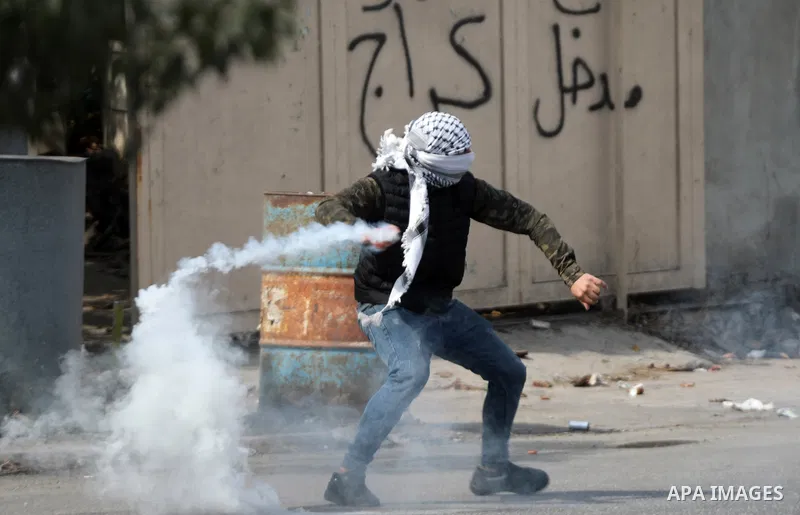 Palestinian protesters clash with Israeli forces following a demonstration calling for the release of Palestinian prisoners on hunger strike in Israeli jails, in the West Bank city of Hebron on October 24, 2021. Seven Pa...