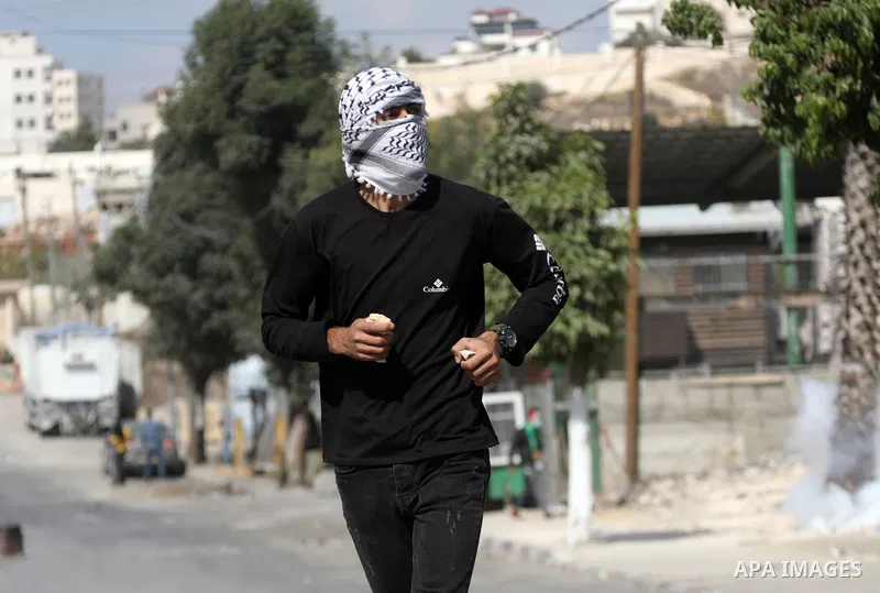 Palestinian protesters clash with Israeli forces following a demonstration calling for the release of Palestinian prisoners on hunger strike in Israeli jails, in the West Bank city of Hebron on October 24, 2021. Seven Pa...