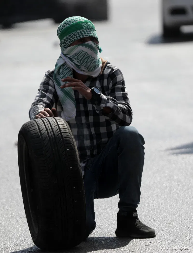 Palestinian protesters clash with Israeli forces following a demonstration calling for the release of Palestinian prisoners on hunger strike in Israeli jails, in the West Bank city of Hebron on October 24, 2021. Seven Pa...