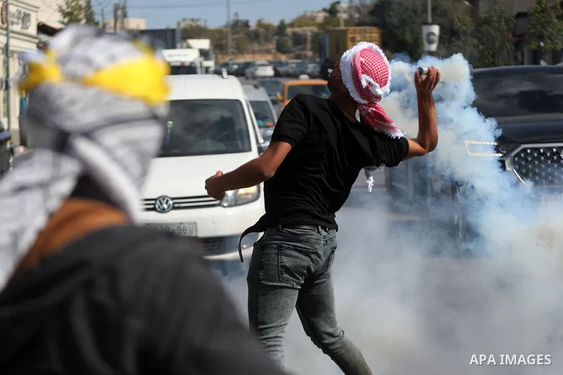 Palestinian protesters clash with Israeli forces following a demonstration calling for the release of Palestinian prisoners on hunger strike in Israeli jails, in the West Bank city of Hebron on October 24, 2021. Seven Pa...
