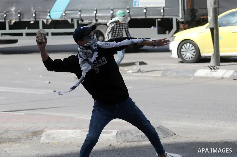 Palestinian protesters clash with Israeli forces following a demonstration calling for the release of Palestinian prisoners on hunger strike in Israeli jails, in the West Bank city of Hebron on October 24, 2021. Seven Pa...