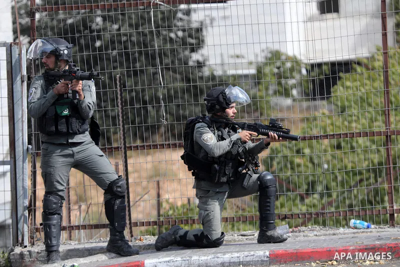 Palestinian protesters clash with Israeli forces following a demonstration calling for the release of Palestinian prisoners on hunger strike in Israeli jails, in the West Bank city of Hebron on October 24, 2021. Seven Pa...