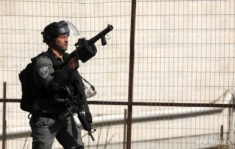 Palestinian protesters clash with Israeli forces following a demonstration calling for the release of Palestinian prisoners on hunger strike in Israeli jails, in the West Bank city of Hebron on October 24, 2021. Seven Pa...