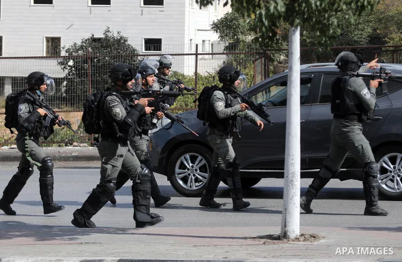 Palestinian protesters clash with Israeli forces following a demonstration calling for the release of Palestinian prisoners on hunger strike in Israeli jails, in the West Bank city of Hebron on October 24, 2021. Seven Pa...